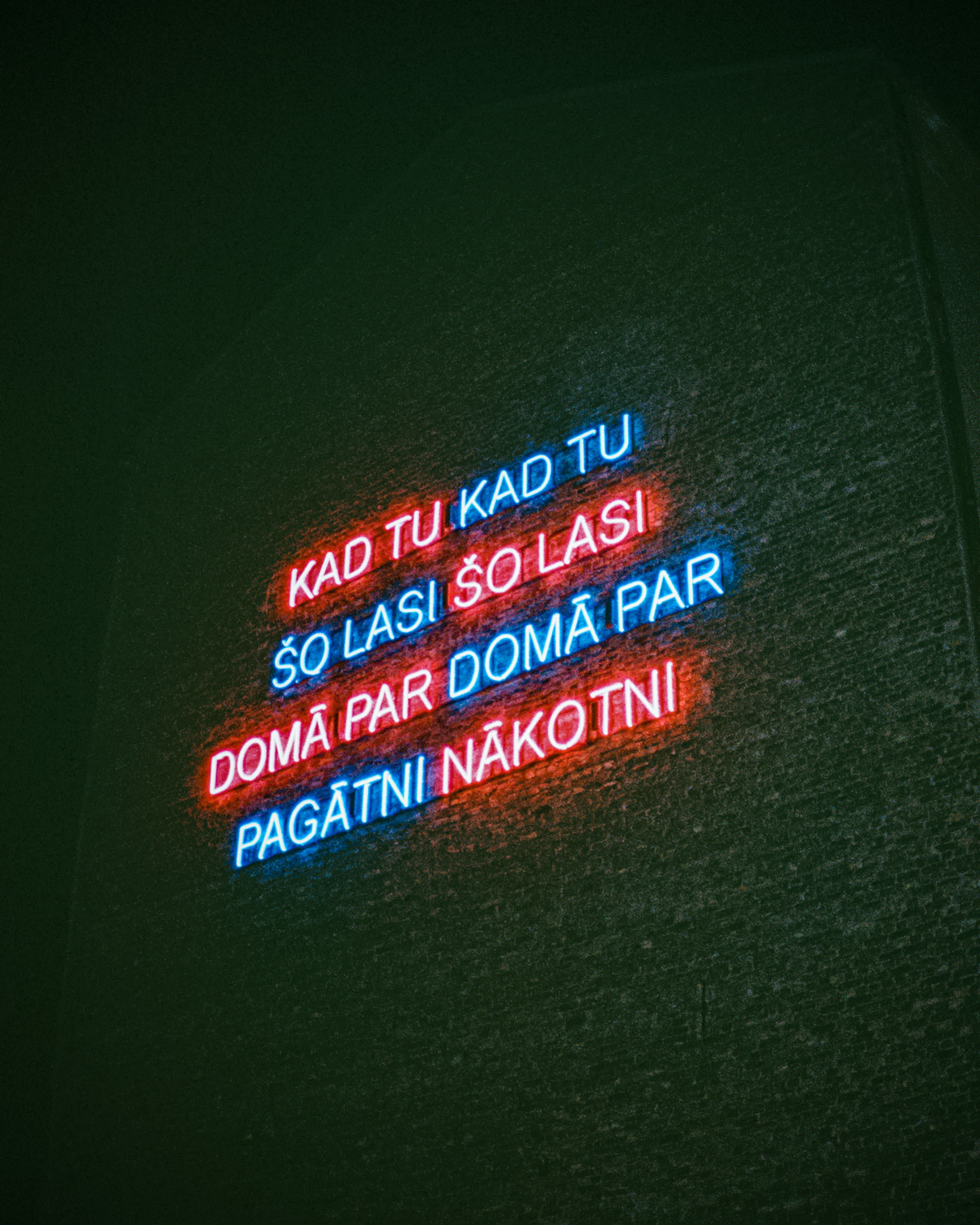 a neon sign on the side of a building
